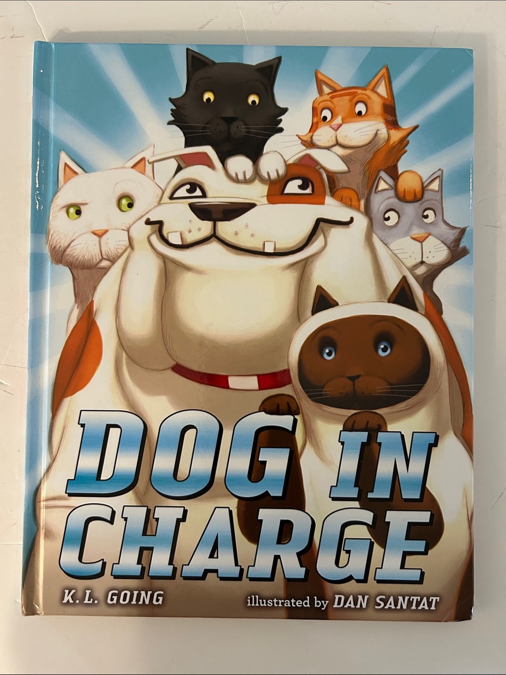 Dog In Charge Hardcover Picture Book by K.L. Going about a dog managing cats